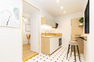 a small kitchen with a sink and a counter at joli & charmant au centre Millau in Millau