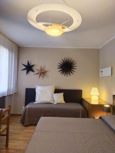 Postel nebo postele na pokoji v ubytování B&B Paolo e Francesca
