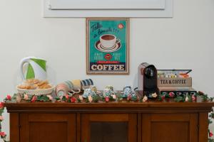 a table with a coffee sign on top of it at MJ Venice Guest House in Marghera