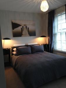 Un pat sau paturi într-o cameră la Central Cambridge House