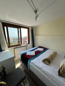 a small bedroom with a bed and a window at Apart La Mia in Istanbul +135 photos
