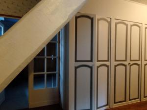 a wall of sliding doors in a room with a staircase at Maison familiale 10 pers avec jardin et parking à Saint-Georges d'Oléron - FR-1-778-31 in Saint-Georges-dʼOléron