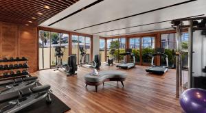 a gym with treadmills and elliptical machines at Holiday Inn Resort Bali Canggu by IHG in Canggu