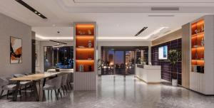 a restaurant with a dining table and a view of the city at Sally Hotel in Yen