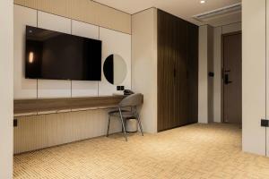 TV a/nebo společenská místnost v ubytování Hanoi International Hotel