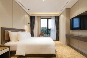 TV a/nebo společenská místnost v ubytování Hanoi International Hotel