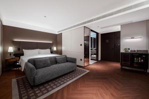 Ένα ή περισσότερα κρεβάτια σε δωμάτιο στο Intercity Hotel Shantou CHJ