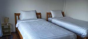 Postel nebo postele na pokoji v ubytování Pai sunrise camping resort