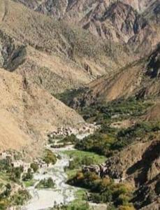 a mountain view of a river in a valley at Treks in imlil in Imlil