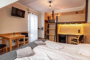 Posteľ alebo postele v izbe v ubytovaní Granada Pensjonat & SPA