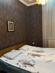 Postel nebo postele na pokoji v ubytování Sesi House