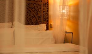 Cama o camas de una habitación en AbraCadabra Suites