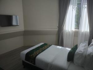 TV a/nebo společenská místnost v ubytování Telang Usan Hotel Kuching