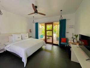 Voodi või voodid majutusasutuse Seaside Dhigurah toas
