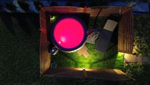 a red traffic light sitting on the grass at Apartament Starówka in Konin