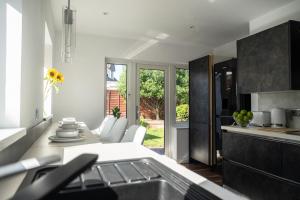 a kitchen with a sink and a counter top at Renata's House in Bristol
