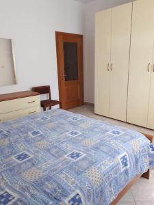 Postel nebo postele na pokoji v ubytování Casa Morgana a Villatico