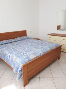 Postel nebo postele na pokoji v ubytování Casa Morgana a Villatico + 6 fotografií