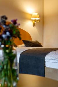 Ένα ή περισσότερα κρεβάτια σε δωμάτιο στο Aparthotel Pfeffermühle