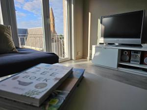 TV i/ili multimedijalni sistem u objektu Côte à l'Oostduinkerke met gratis garage
