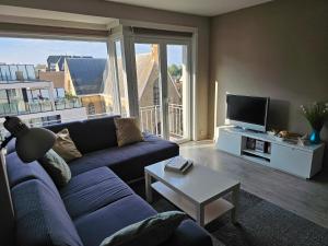 TV i/ili multimedijalni sistem u objektu Côte à l'Oostduinkerke met gratis garage