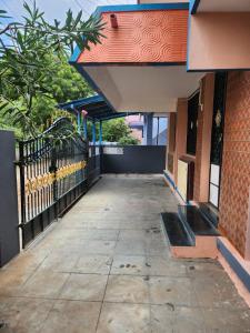 an empty hallway of a building with a fence at Holiday Home Madurai CS Nagar - GF in Madurai