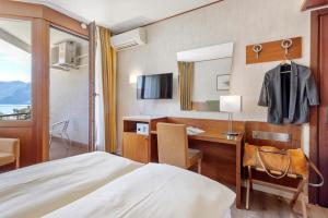 Hotel Delfino Lugano客房内的一张或多张床位