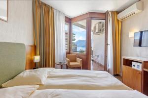 Hotel Delfino Lugano客房内的一张或多张床位