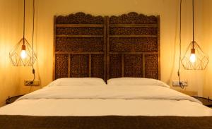 Cama o camas de una habitación en AbraCadabra Suites