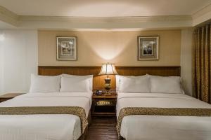 Postel nebo postele na pokoji v ubytování Villa Caceres Hotel