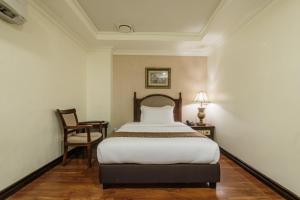 Postel nebo postele na pokoji v ubytování Villa Caceres Hotel