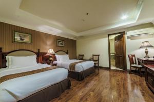 Postel nebo postele na pokoji v ubytování Villa Caceres Hotel