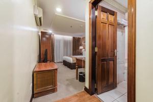 Postel nebo postele na pokoji v ubytování Villa Caceres Hotel
