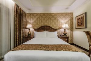 Postel nebo postele na pokoji v ubytování Villa Caceres Hotel