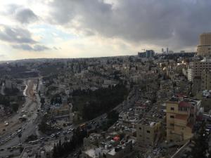 an aerial view of a city with traffic at Zaina Plaza Hotel in Amman