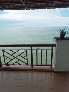 a view of the ocean from a balcony at Homestay PD LESTARI 2 in Port Dickson +20 photos