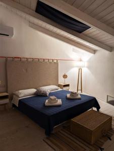 Postel nebo postele na pokoji v ubytování AltaMarea - Luce, spazi ampi e comfort al centro del paese