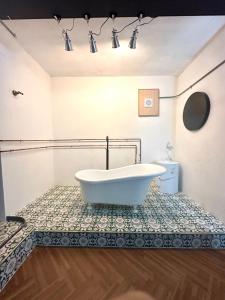a bathroom with a tub and a toilet at TwoTwo House in Seoul +103 photos