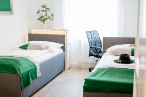 Rúm í herbergi á zimmer-graz