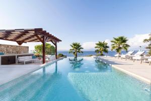 a swimming pool with a view of the ocean at Villa Romana - Luxury Estate in Stomorska