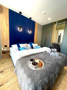 Ένα ή περισσότερα κρεβάτια σε δωμάτιο στο CTS Apartament GÓRSKI DIAMENT - SAUNA