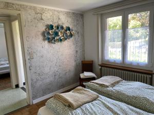 Postel nebo postele na pokoji v ubytování Wohnung in 100 J Bauernhaus