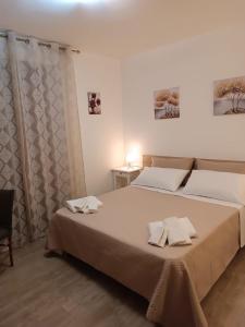 Ένα ή περισσότερα κρεβάτια σε δωμάτιο στο La GIOIA