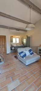 a bedroom with a bed in the middle of a room at Maison bord de mer - piscine - in Théoule-sur-Mer