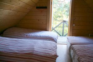 Postel nebo postele na pokoji v ubytování Vango Holiday Village