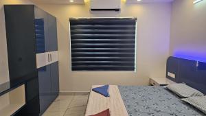 Ένα ή περισσότερα κρεβάτια σε δωμάτιο στο Premium Apartment In Trivandrum City