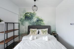 En eller flere senge i et værelse på Primaveri Sunset 1112