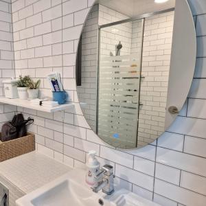 a bathroom with a sink and a mirror at Hotel Irua Haeundae in Busan +279 photos