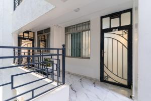 a pair of doors on a house with marble floors at Serene Homes in Ruiru