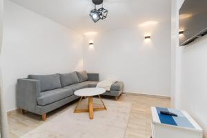 a living room with a couch and a table at Serene Homes in Ruiru